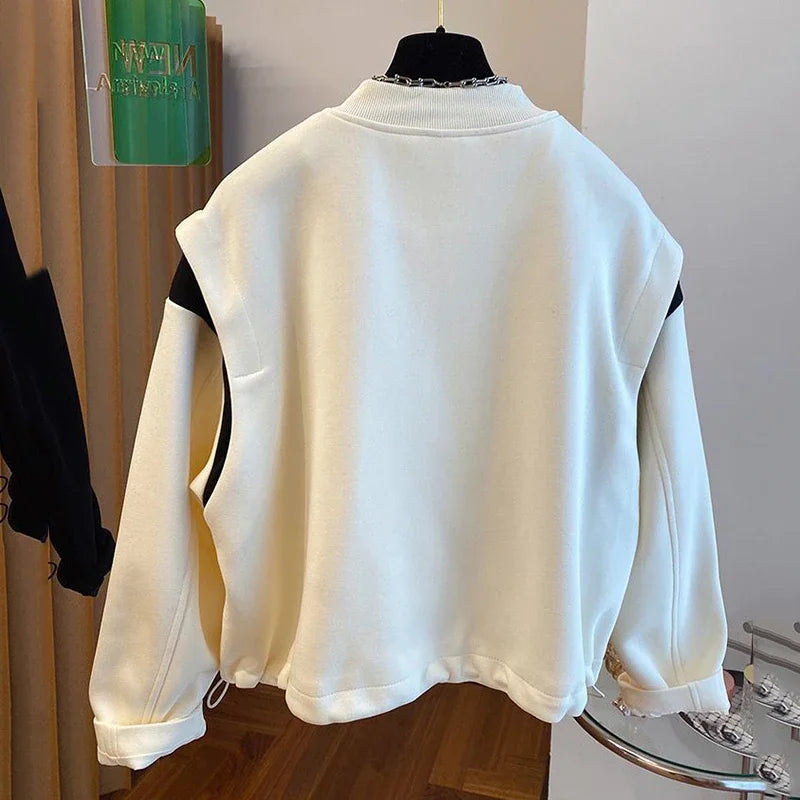 Stand Collar Baseball Jacket: Patchwork design, cozy fit, spring wardrobe essential.