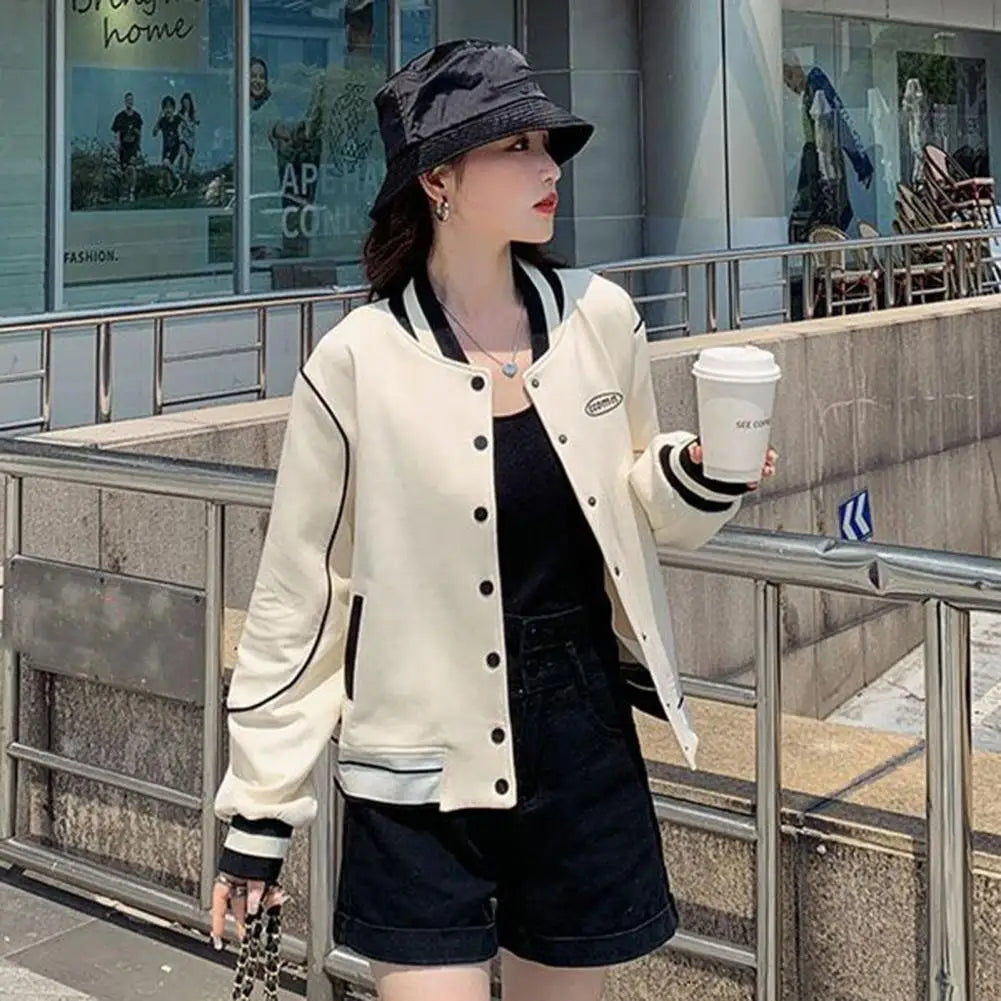 Color-block baseball coat with stand collar, pockets. Fashionable and functional.